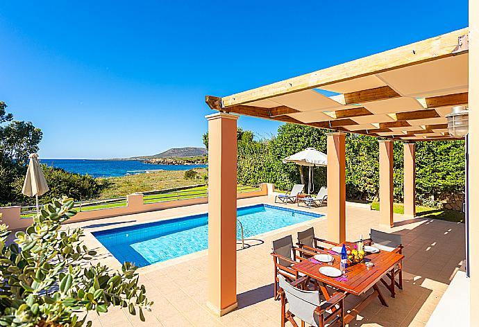 Sheltered terrace area with sea views . - Antigoni Beach House . (Photo Gallery) }}