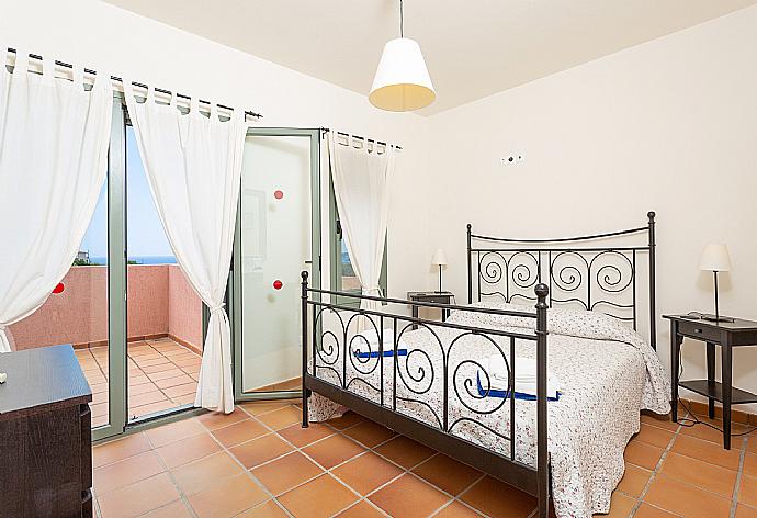 Double bedroom with A/C and deck access . - Villa Vali . (Photo Gallery) }}