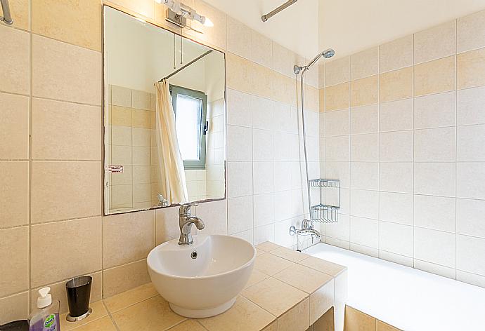 En suite bathroom with bath and shower . - Villa Katerina . (Photo Gallery) }}