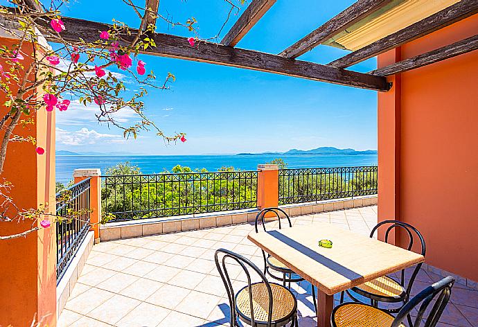 Upper terrace area with sea views . - Villa Youla . (Photo Gallery) }}