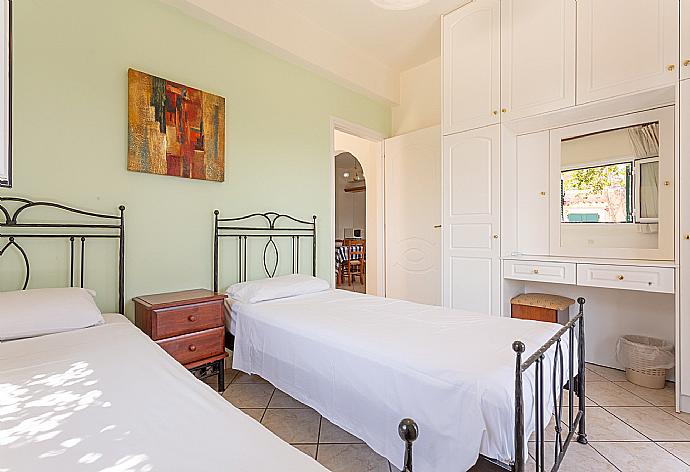 Twin bedroom with A/C and terrace access . - Villa Vasillis . (Photo Gallery) }}