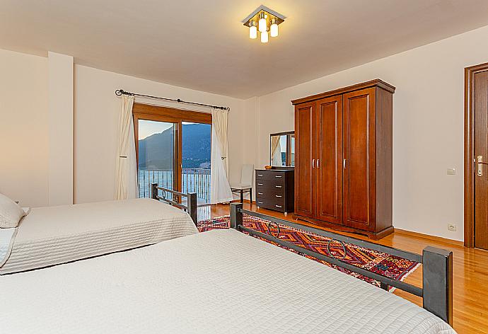 Twin bedroom with en suite bathroom, A/C, and panoramic sea views . - Villa Lara . (Photo Gallery) }}