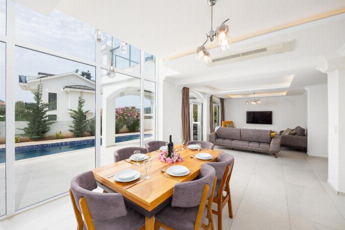 Open-plan living room with sofas, dining area, kitchen, A/C, WiFi internet, and satellite TV . - Orka World Villa 2 . (Photo Gallery) }}