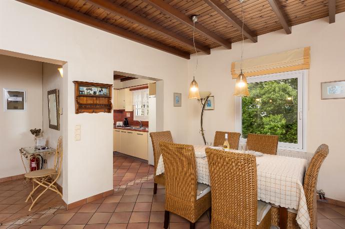 Living room on first floor with sofas, dining area, ornamental fireplace, WiFi internet, satellite TV, and sea views . - Villa Eleni . (Fotogalerie) }}