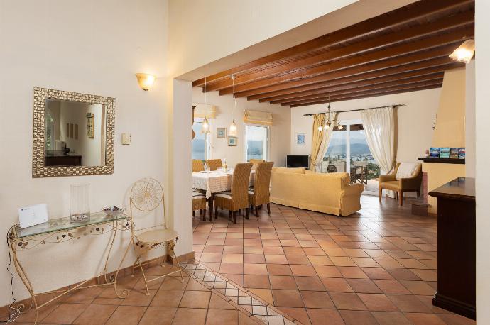 Living room on first floor with sofas, dining area, ornamental fireplace, WiFi internet, satellite TV, and sea views . - Villa Eleni . (Fotogalerie) }}