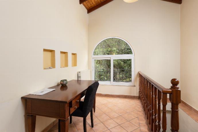 Living room on first floor with sofas, dining area, ornamental fireplace, WiFi internet, satellite TV, and sea views . - Villa Eleni . (Fotogalerie) }}