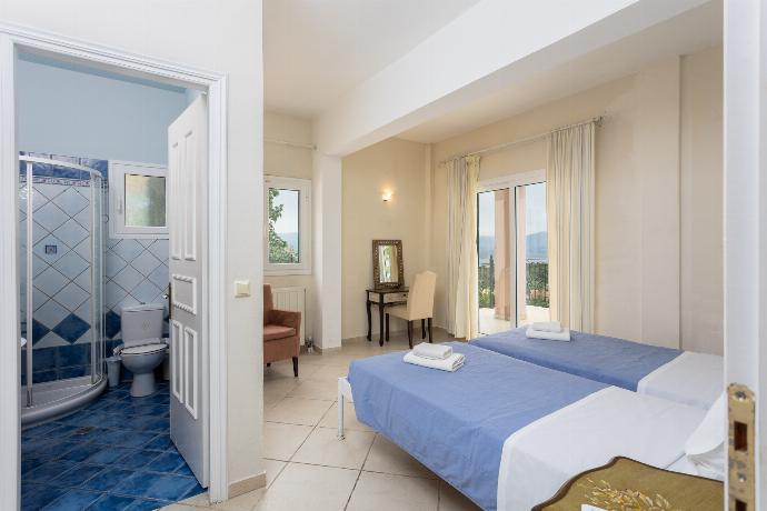Twin bedroom on ground floor with en suite bathroom and A/C . - Villa Eleni . (Photo Gallery) }}