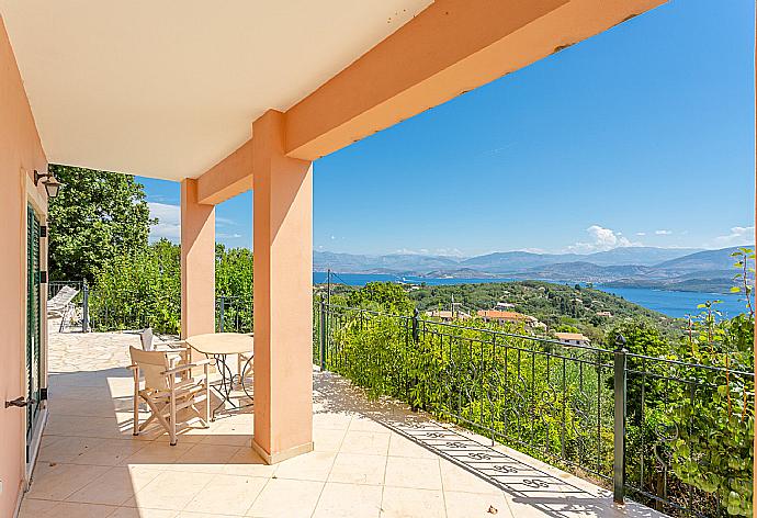 Sheltered terrace area with sea views . - Villa Eleni . (Photo Gallery) }}