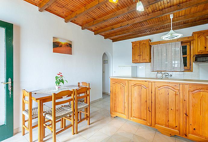 Living room with sofa, dining area, kitchen, and terrace access . - Villa Sofia . (Galleria fotografica) }}