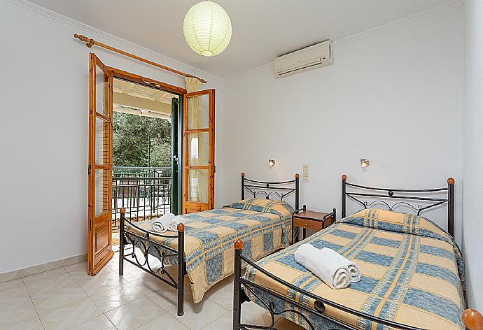 Twin bedroom with A/C and terrace access . - Villa Sofia . (Photo Gallery) }}