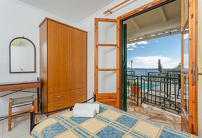 Twin bedroom with A/C and terrace access . - Villa Sofia . (Photo Gallery) }}