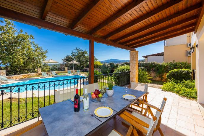 Sheltered terrace area . - Villa Daphni . (Photo Gallery) }}
