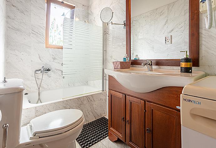 Family bathroom with bath and shower . - Villa Tzina . (Photo Gallery) }}
