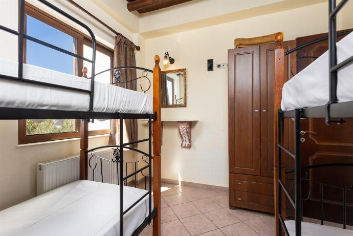 Bedroom with two bunk beds and A/C . - Villa Melina . (Photo Gallery) }}