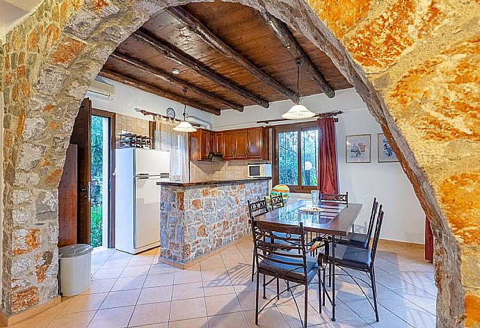 Open-plan living room with sofas, dining area, kitchen, indoor pool, A/C, WiFi internet, TV, DVD player, and terrace access . - Villa Nineta . (Fotogalerie) }}