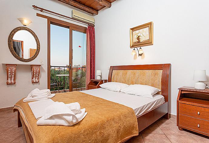 Double bedroom with A/C and balcony access . - Villa Nineta . (Photo Gallery) }}