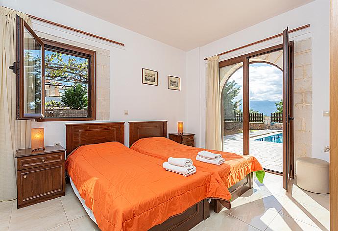 Twin bedroom with A/C and pool terrace access . - Villa Eva . (Photo Gallery) }}