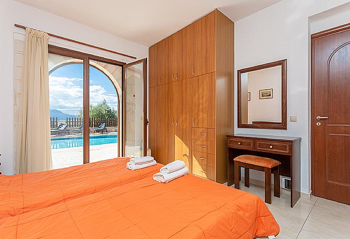 Twin bedroom with A/C and pool terrace access . - Villa Eva . (Photo Gallery) }}