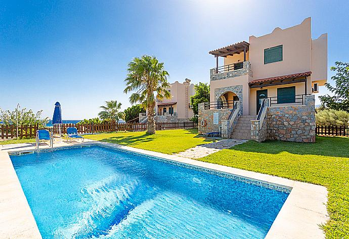 ,Beautiful villa with private pool, lawn, and terrace with sea views . - Andreas Beach Villa . (Galleria fotografica) }}