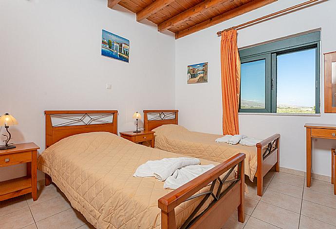 Twin bedroom with A/C and balcony access with sea views . - Andreas Beach Villa . (Photo Gallery) }}