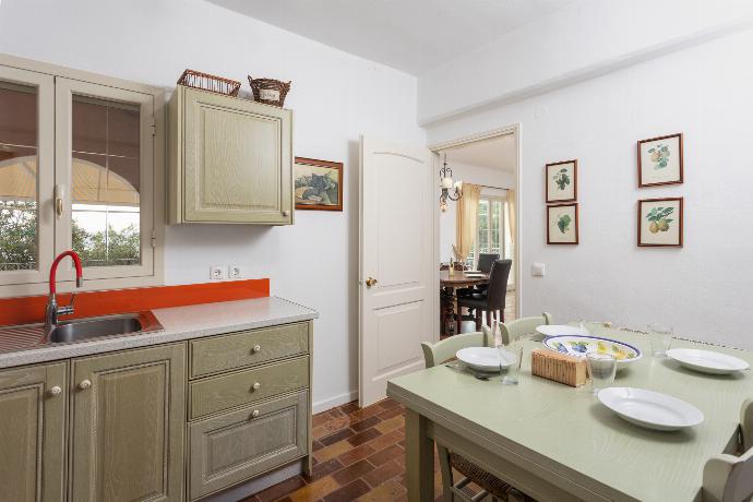 Equipped kitchen on ground floor with dining area . - Villa Anastasia . (Photo Gallery) }}