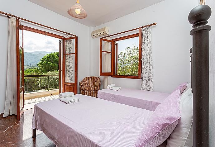 Twin bedroom with A/C and terrace access . - Cochelli Villa Lower . (Photo Gallery) }}