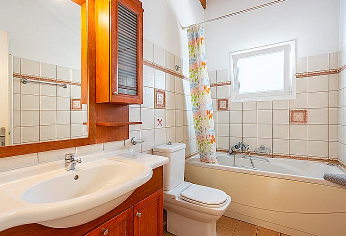 En suite bathroom with bath and shower . - Villa Petros . (Photo Gallery) }}