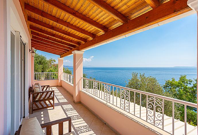 Sheltered upper terrace are with panoramic sea views . - Villa Petros . (Photo Gallery) }}