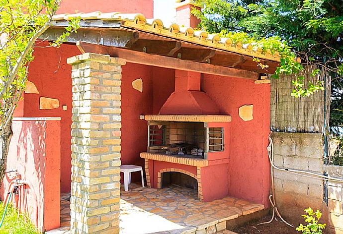 ,Terrace area with BBQ . - Villa Ioanna Agios Stephanos . (Photo Gallery) }}