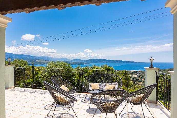 Terrace area with sea views . - Villa Ioanna Agios Stephanos . (Photo Gallery) }}
