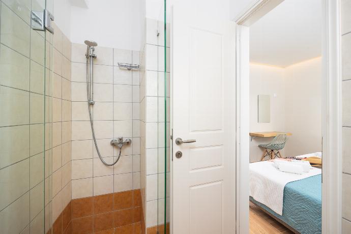 En suite bathroom with shower . - Villa Ioanna Agios Stephanos . (Photo Gallery) }}
