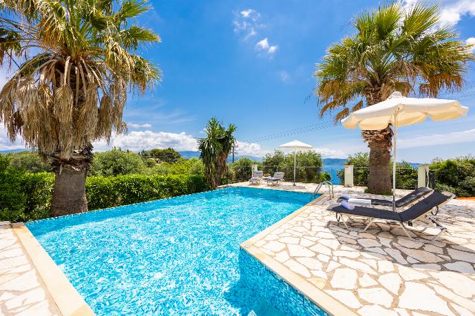 Private pool and terrace with sea views . - Villa Ioanna Agios Stephanos . (Photo Gallery) }}