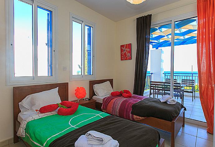Twin bedroom with A/C and balcony access . - Riviera Beach Front . (Fotogalerie) }}