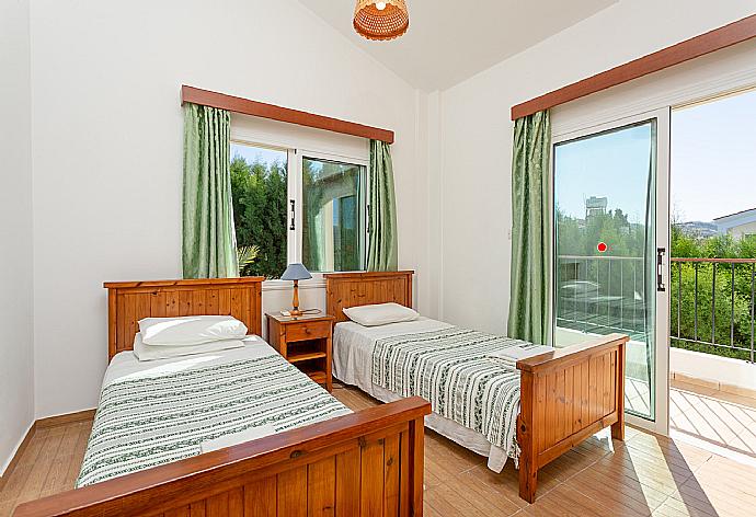 Twin bedroom with A/C and balcony access . - Villa Alexandros . (Photo Gallery) }}