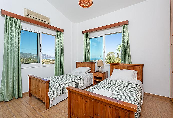 Twin bedroom with A/C and balcony access . - Villa Alexandros . (Photo Gallery) }}