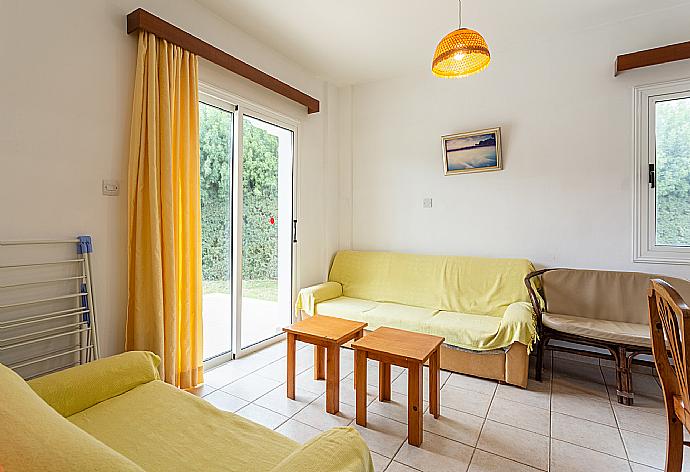 Open-plan living room with sofas, dining area, kitchen, ornamental fireplace, WiFi internet, and satellite TV . - Villa Nansoula . (Galleria fotografica) }}