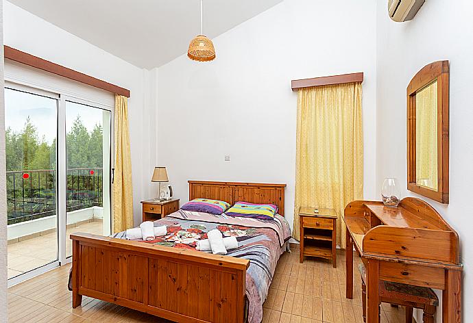 Double bedroom with A/C and balcony access . - Villa Nansoula . (Photo Gallery) }}