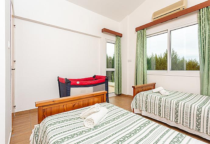 Twin bedroom with A/C and balcony access . - Villa Nansoula . (Photo Gallery) }}