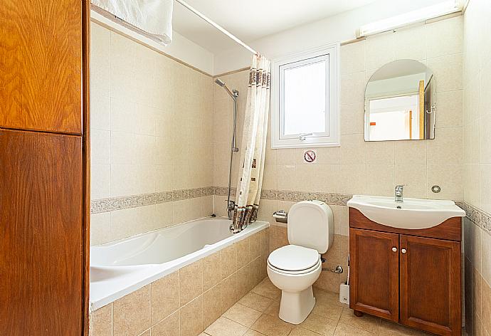 Family bathroom with bath and shower . - Villa Nansoula . (Photo Gallery) }}