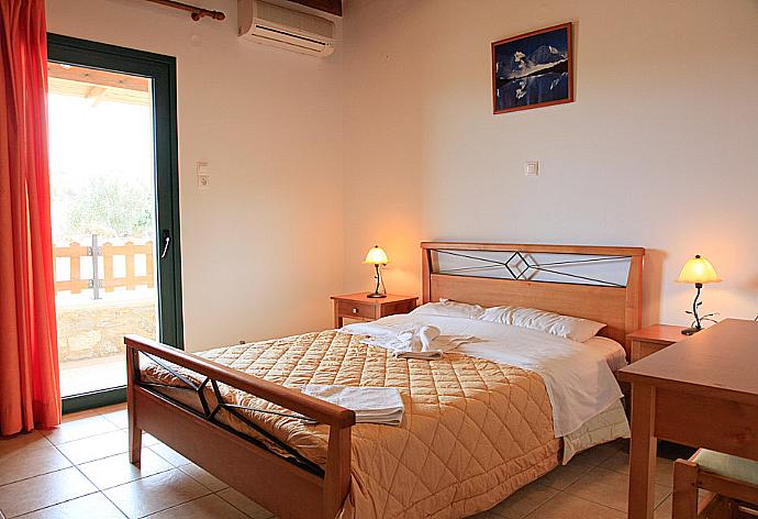 Double bedroom with A/C and terrace access . - Theo Beach Villa . (Photo Gallery) }}