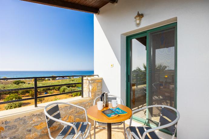 Upper unit: balcony with sea views . - Theo Beach Villa . (Photo Gallery) }}