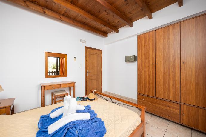 Lower unit: double bedroom with A/C . - Theo Beach Villa . (Photo Gallery) }}