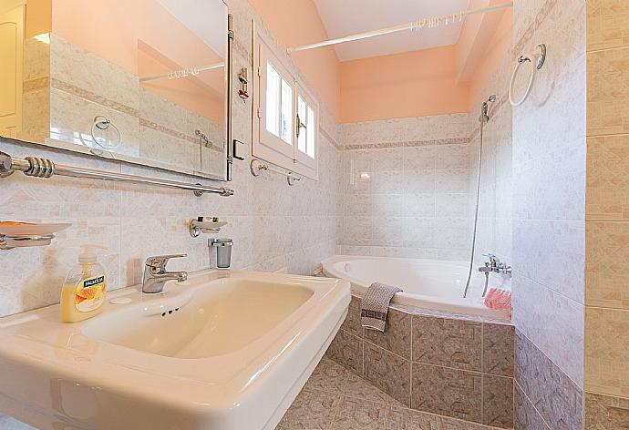 Family bathroom, bath with shower. W/C. . - Lavranos House . (Photo Gallery) }}