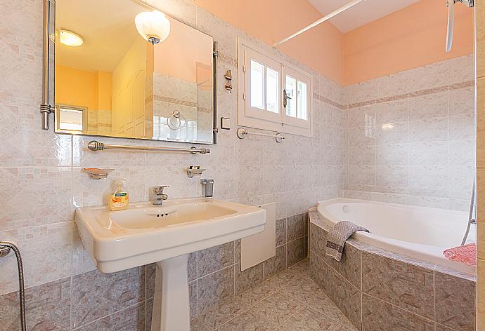 Family bathroom, bath with shower. W/C. . - Lavranos House . (Photo Gallery) }}