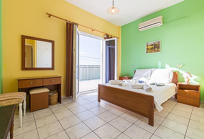 Double bedroom with balcony access . - Villa Ariadni . (Photo Gallery) }}