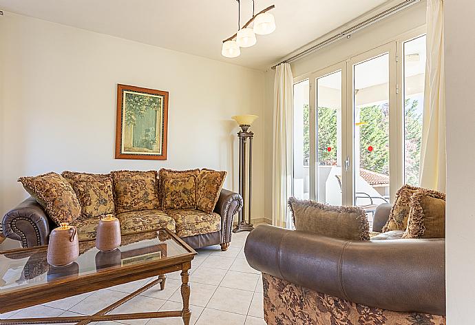 Living room on first floor with sofas, A/C, WiFi internet, satellite TV, and terrace access . - Villa Ismini . (Galleria fotografica) }}