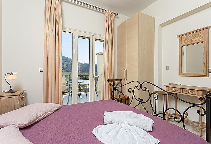 Double bedroom with A/C and balcony access . - Villa Ismini . (Photo Gallery) }}