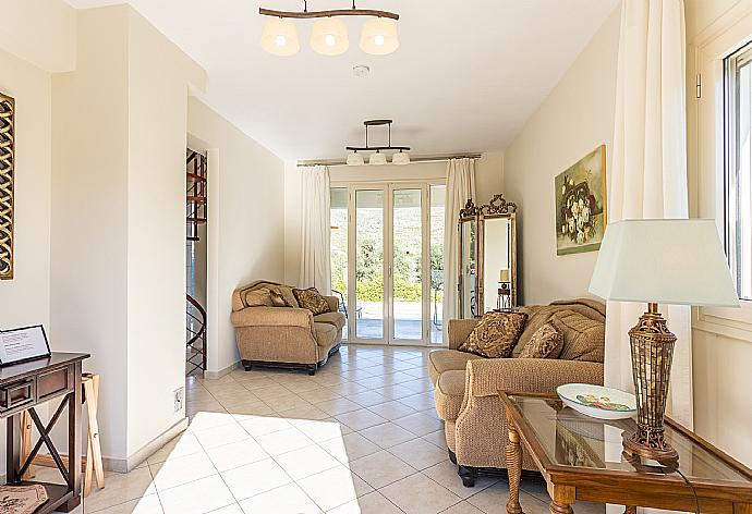 Living room on first floor with sofas, A/C, WiFi internet, satellite TV, and terrace access . - Villa Fedra . (Fotogalerie) }}