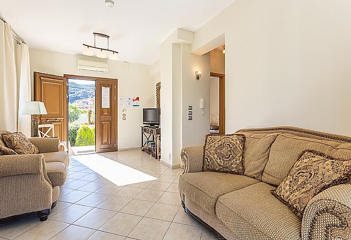 Living room on first floor with sofas, A/C, WiFi internet, satellite TV, and terrace access . - Villa Fedra . (Galerie de photos) }}