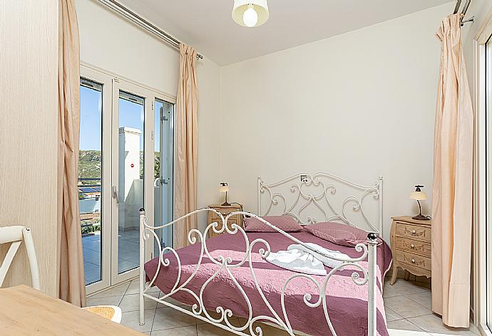 Double bedroom with A/C and balcony access . - Villa Fedra . (Photo Gallery) }}